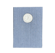 Navy notebook with a wax seal on a white background