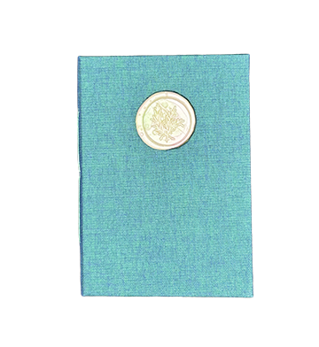 Turquoise textured book with a wax seal on a white background